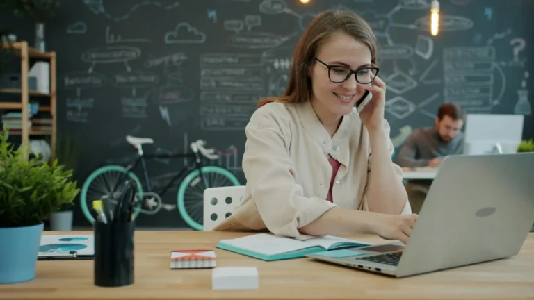 Female on an iPhone in an office or classroom environment